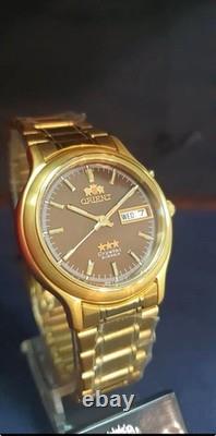 NOS Orient Tristar Automatic Day Date 1EM0200UT8 Brown Dial Made In Japan