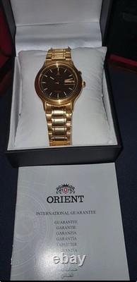 NOS Orient Tristar Automatic Day Date 1EM0200UT8 Brown Dial Made In Japan