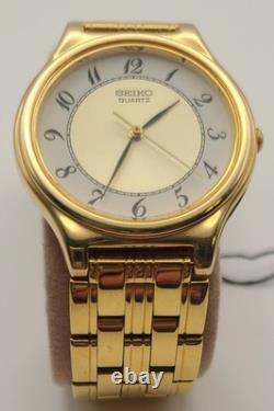 NOSVintage Seiko SFW704 Gold Tone Thin Dress Watch White Dial Arabic Numerals