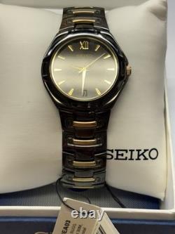 New Old Stock Seiko Men's Quartz Watch Black With Gold Tone Accents SGEA03