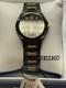 New Old Stock Seiko Men's Quartz Watch Black With Gold Tone Accents SGEA03
