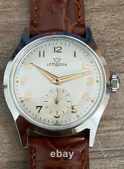 New Old Stock Vintage Lemania 203-PS cal. 3000, mint 33mm Military Style watch