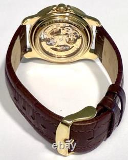 Vintage 39mm Auto Skeleton 17J Goldtone Bezel Brown Strap Invicta Mens Watch