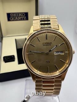 Vintage New Old Stock Seiko SQ Day Date Gold Tone Elegant Sporty Stretch Band
