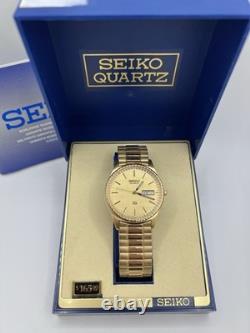 Vintage New Old Stock Seiko SQ Day Date Gold Tone Elegant Sporty Stretch Band