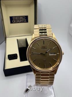 Vintage New Old Stock Seiko SQ Day Date Gold Tone Elegant Sporty Stretch Band