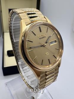 Vintage New Old Stock Seiko SQ Day Date Gold Tone Elegant Sporty Stretch Band