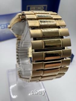 Vintage New Old Stock Seiko SQ Day Date Gold Tone Elegant Sporty Stretch Band