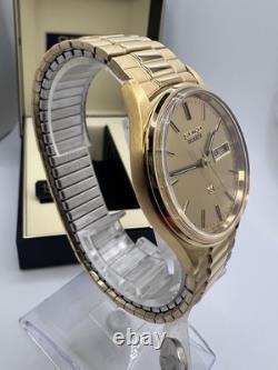 Vintage New Old Stock Seiko SQ Day Date Gold Tone Elegant Sporty Stretch Band