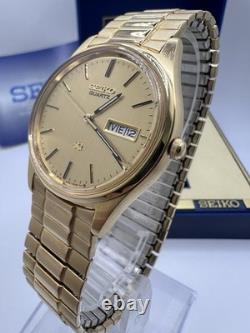 Vintage New Old Stock Seiko SQ Day Date Gold Tone Elegant Sporty Stretch Band