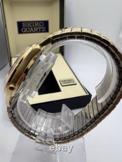 Vintage New Old Stock Seiko SQ Day Date Gold Tone Elegant Sporty Stretch Band