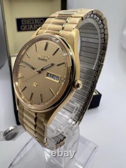 Vintage New Old Stock Seiko SQ Day Date Gold Tone Elegant Sporty Stretch Band