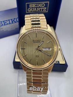 Vintage New Old Stock Seiko SQ Day Date Gold Tone Elegant Sporty Stretch Band
