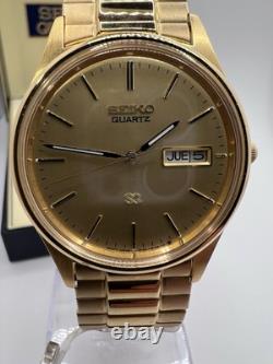 Vintage New Old Stock Seiko SQ Day Date Gold Tone Elegant Sporty Stretch Band