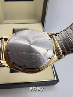 Vintage New Old Stock Seiko SQ Day Date Gold Tone Elegant Sporty Stretch Band