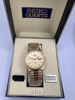Vintage New Old Stock Seiko SQ Day Date Gold Tone Elegant Sporty Stretch Band