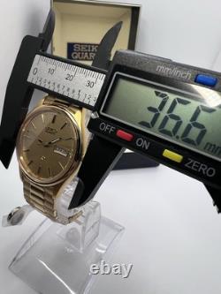 Vintage New Old Stock Seiko SQ Day Date Gold Tone Elegant Sporty Stretch Band